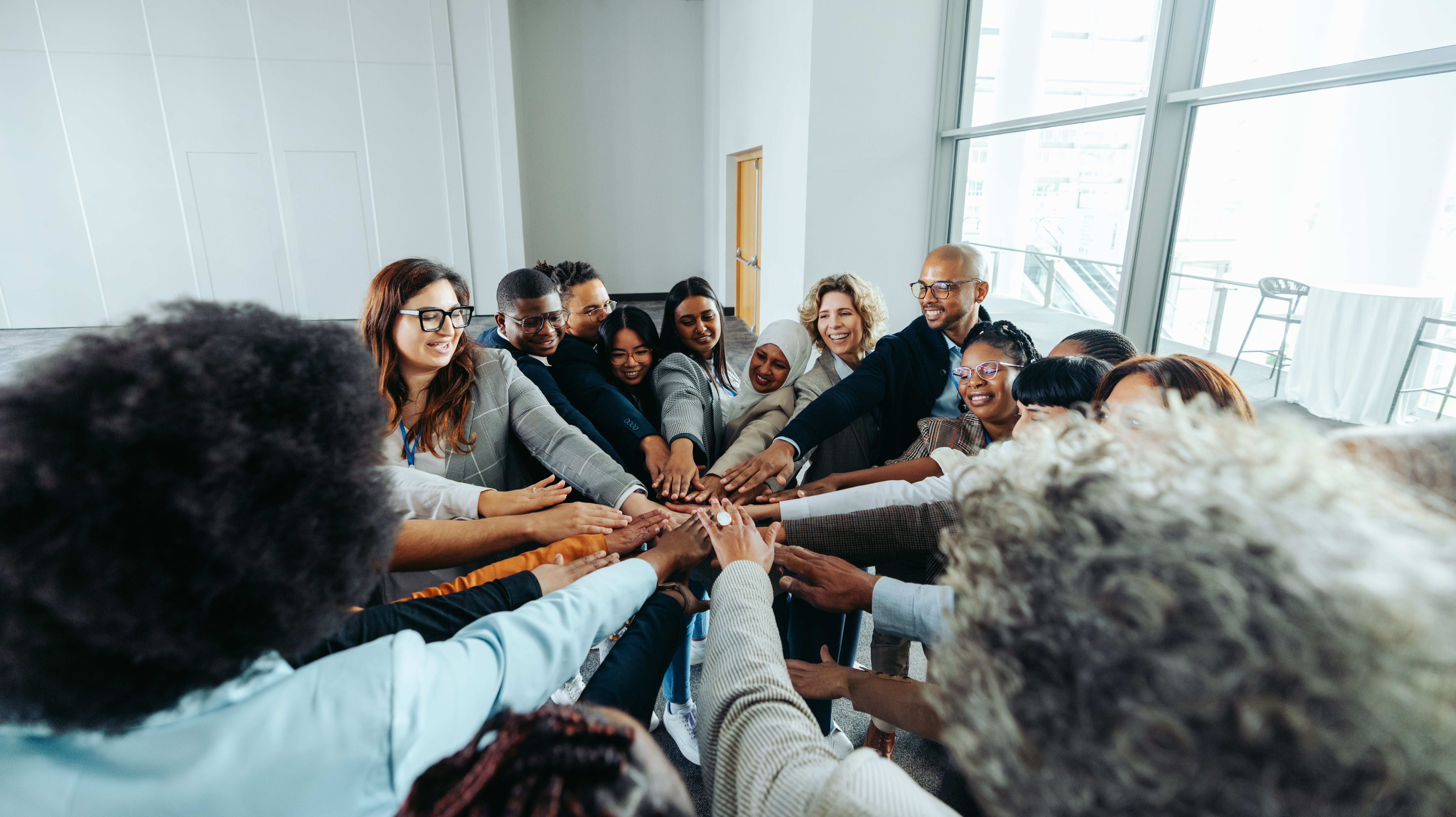 Diverse team of professionals collaborating together and solving problems in modern office