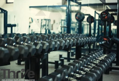 multiple racks of dumbells in a weightroom