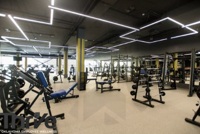 a large weightroom with many areas for free weights